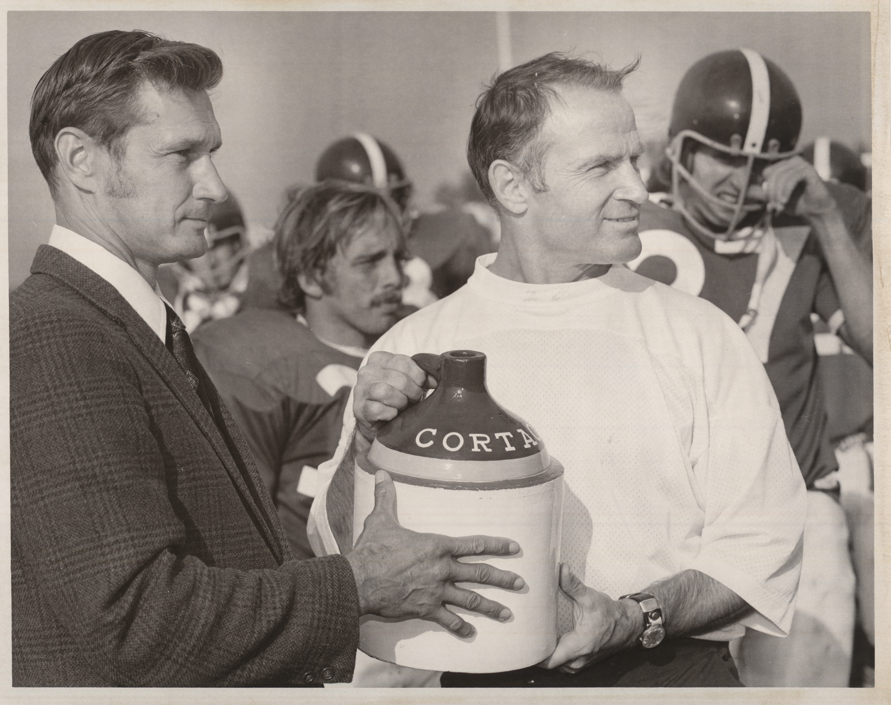 Football coach Jim Butterfield with the Cortaca Jug