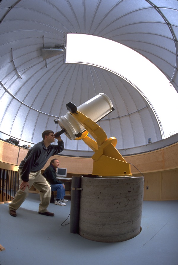 Student looking through the telescope