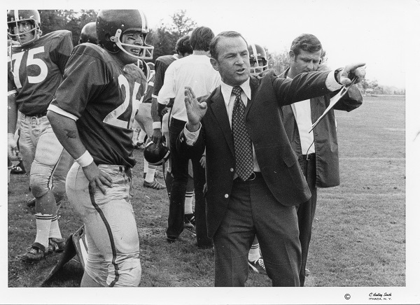 Jim Butterfield giving a football player instructions